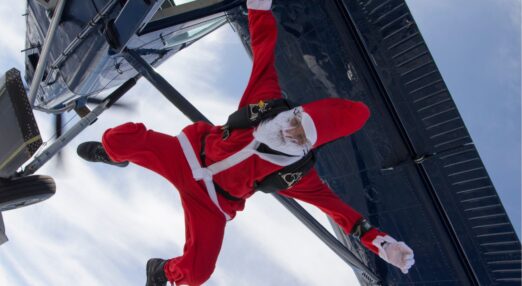 Someone dressed as Father Christmas doing a skydive