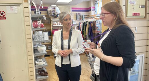 MP Daisy Cooper in Rennie Grove Peace charity shop, St Albans