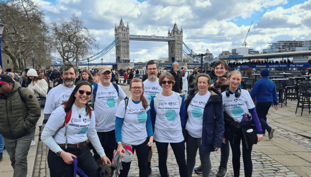 Supporters doing the London Bridges Walk with Tower Bridge in the background