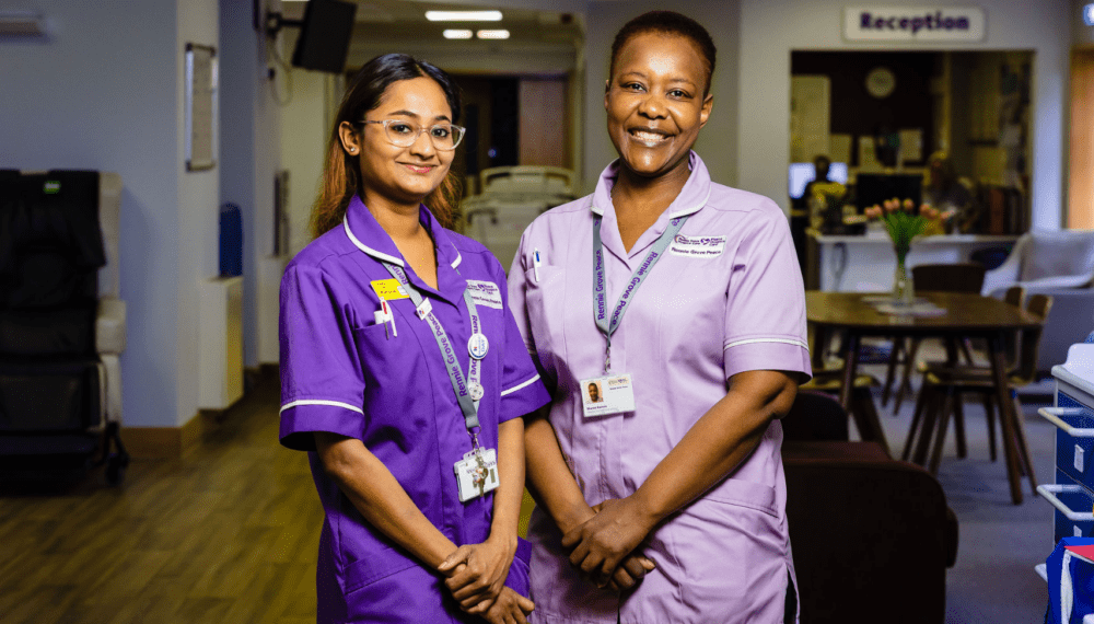 two hospice nurses smiling