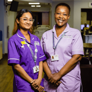 two hospice nurses smiling