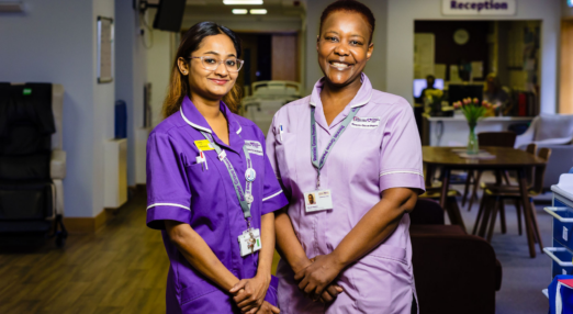 two hospice nurses smiling