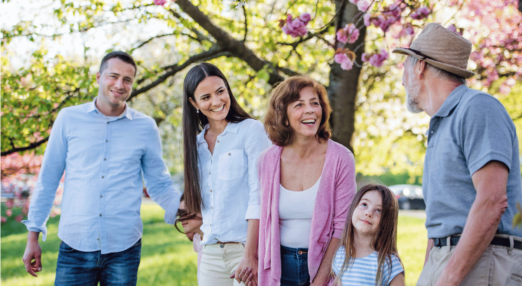 Three generation family on a walk outside in spring nature.