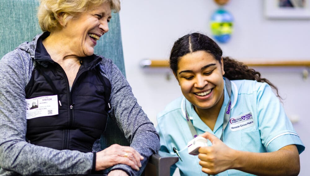 Nurse and patient smiling