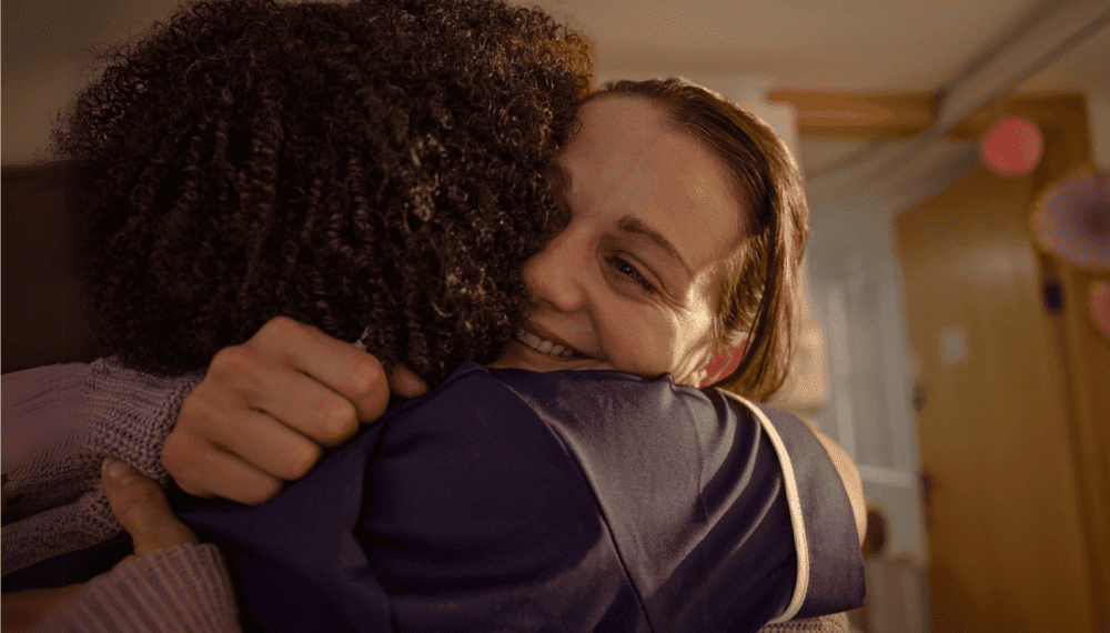 person hugging nurse in a hospice
