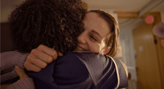 person hugging nurse in a hospice