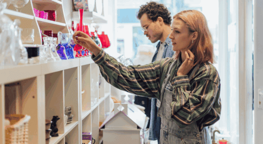 two people shopping in a charity shop