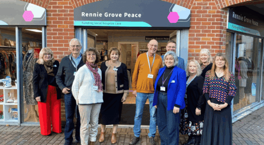 Staff and volunteers standing outside the new Rennie Grove Peace Chesham shop.