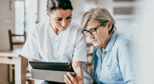 Healthcare professional helping a patient